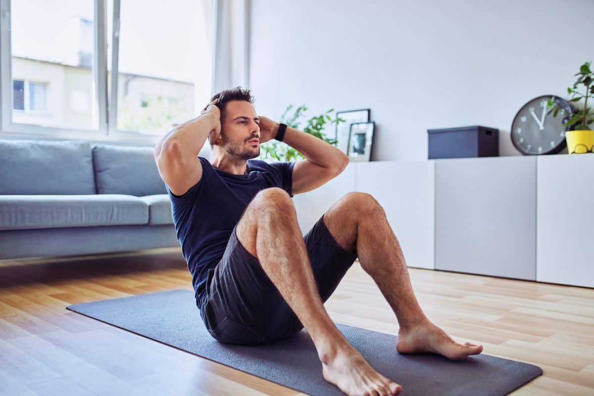 Man doing situps at home